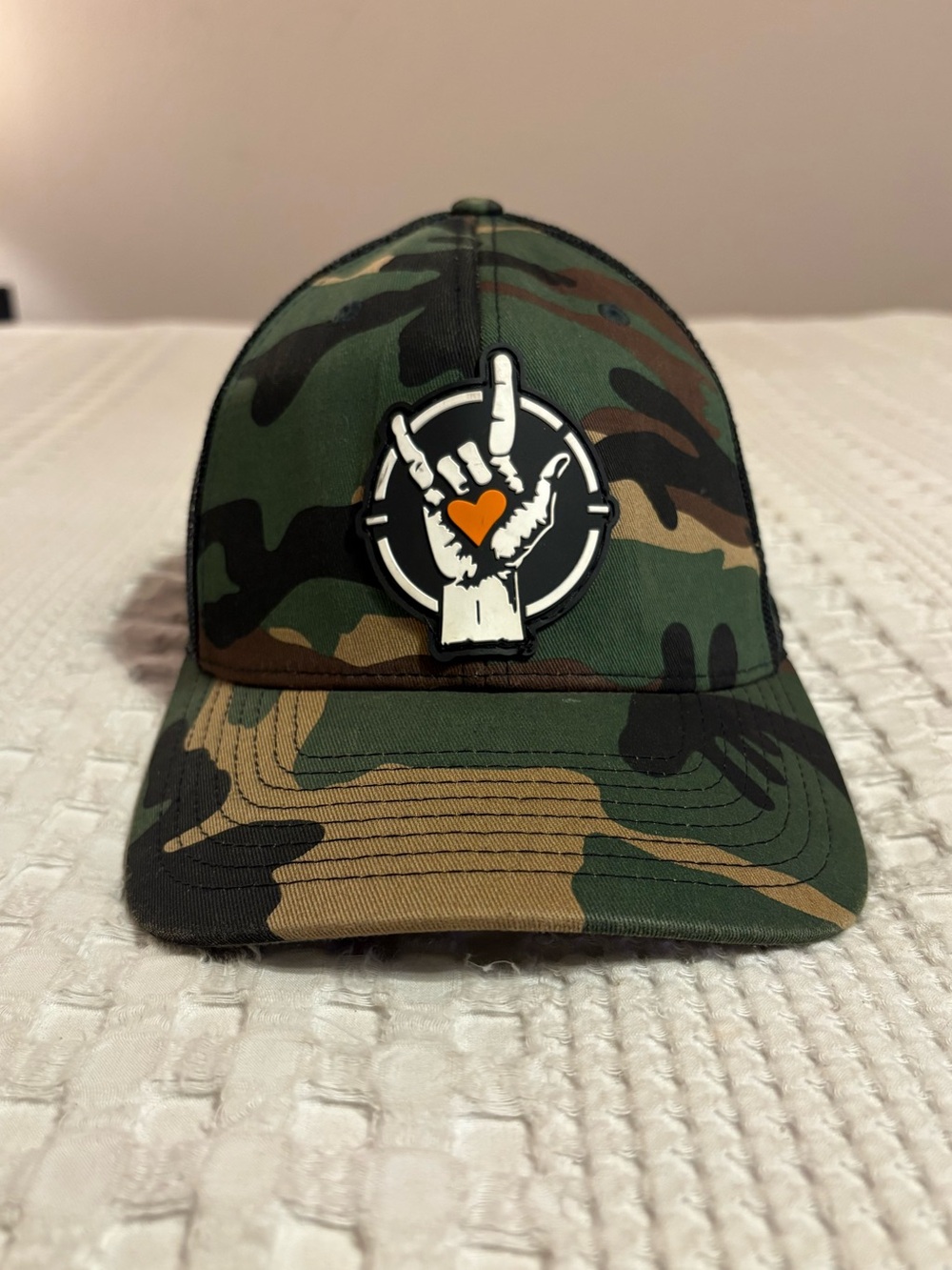 Project Savior Camo Trucker Hat with Heart Hand Patch - Green Camouflage